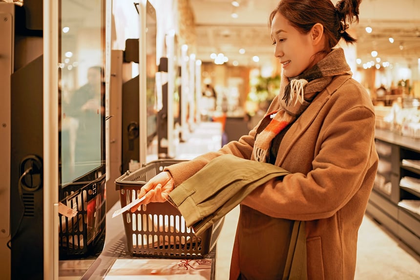 Woman Shopping at Self - Checkout Counter in Store