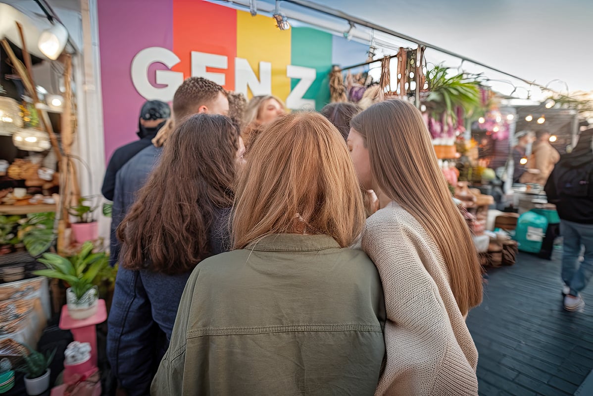 Gen Z friends at a pop-up event or street market