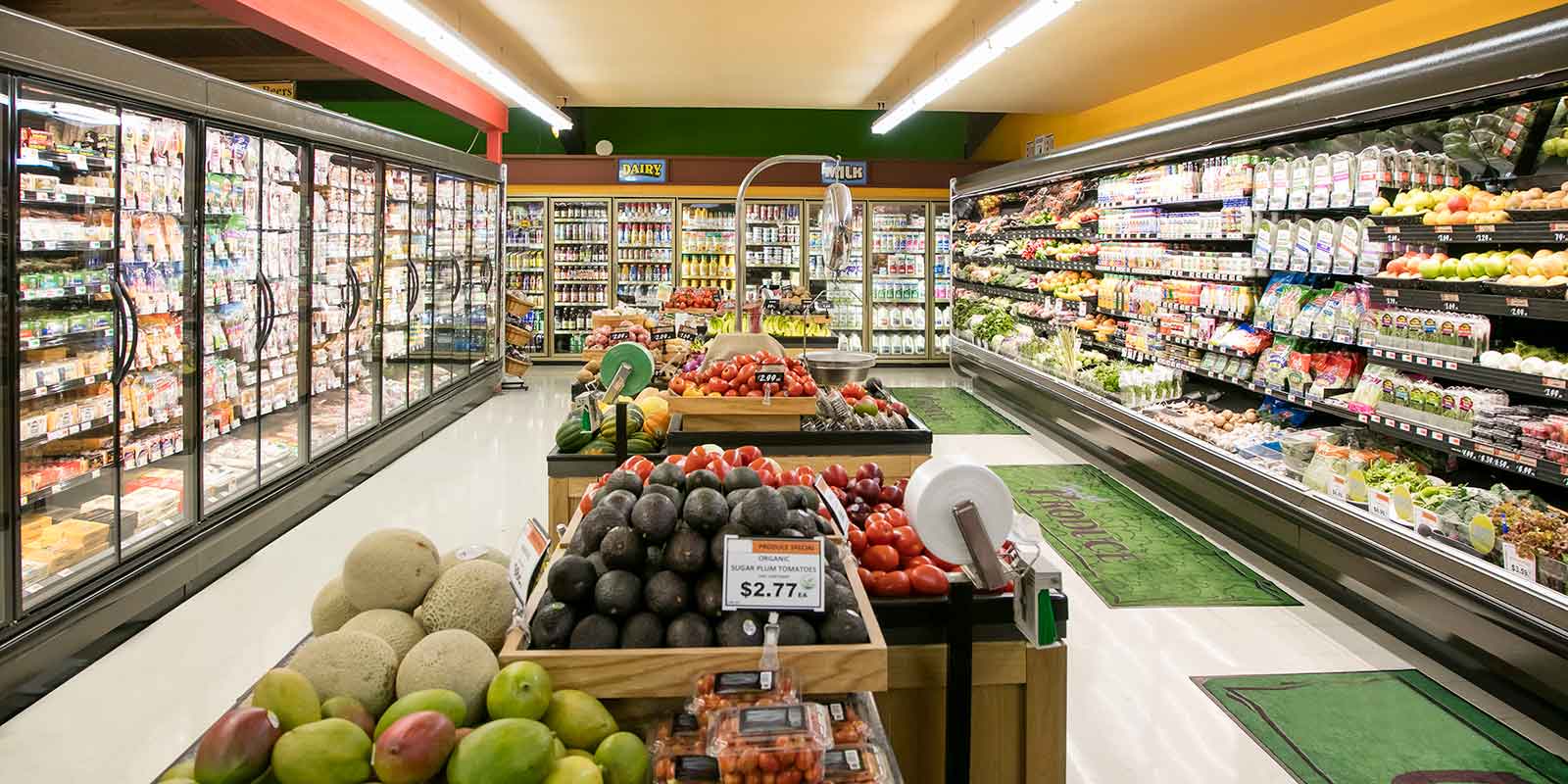 fresh aisle in grocery store featuring fruit and decor