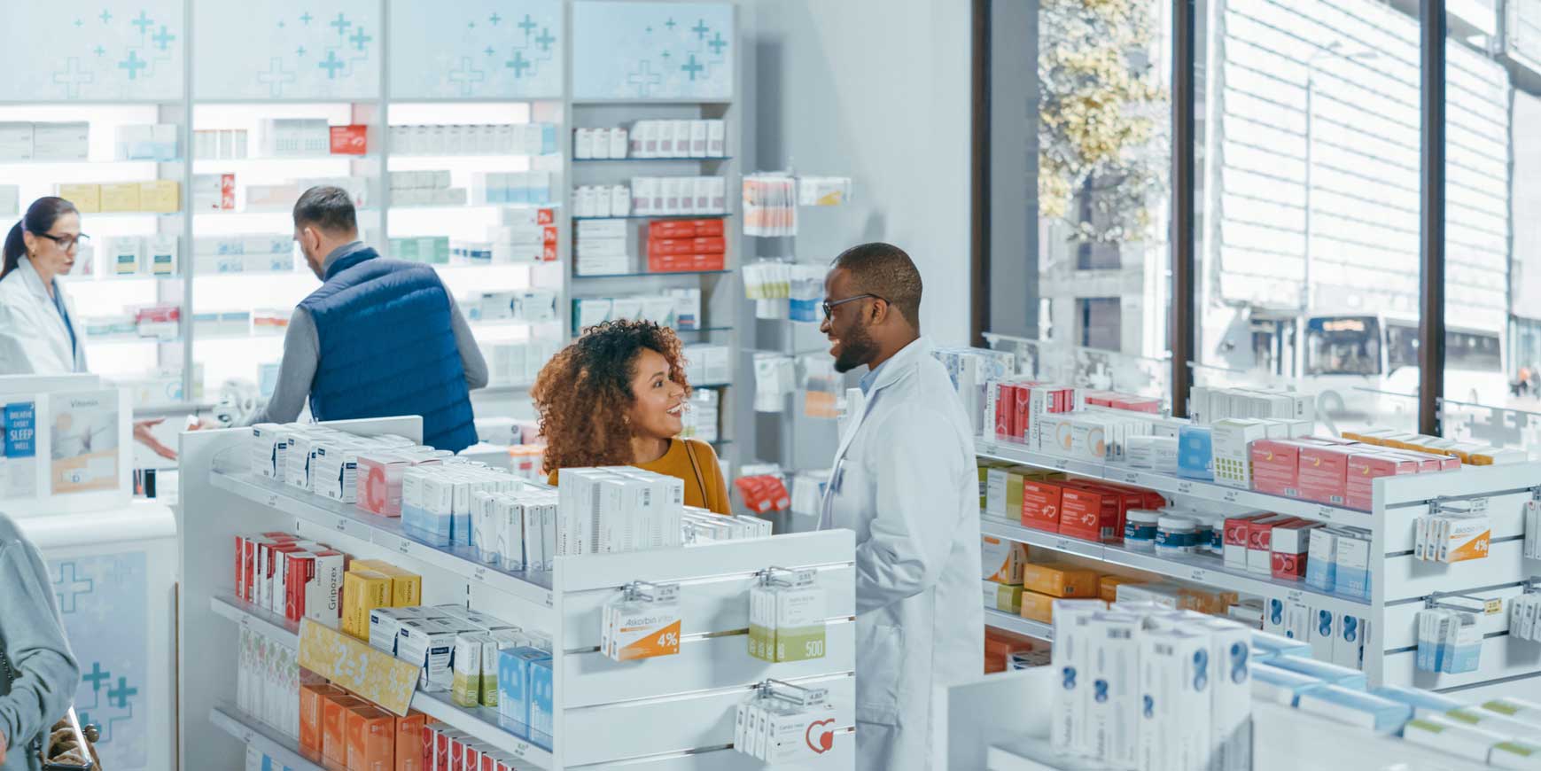 pharmacy drugstore with diverse people shopping
