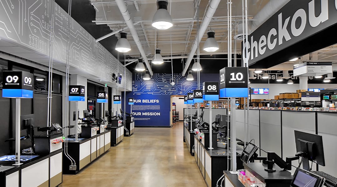 check out area with lit signs for wayfinding check out area with lit signs for wayfinding